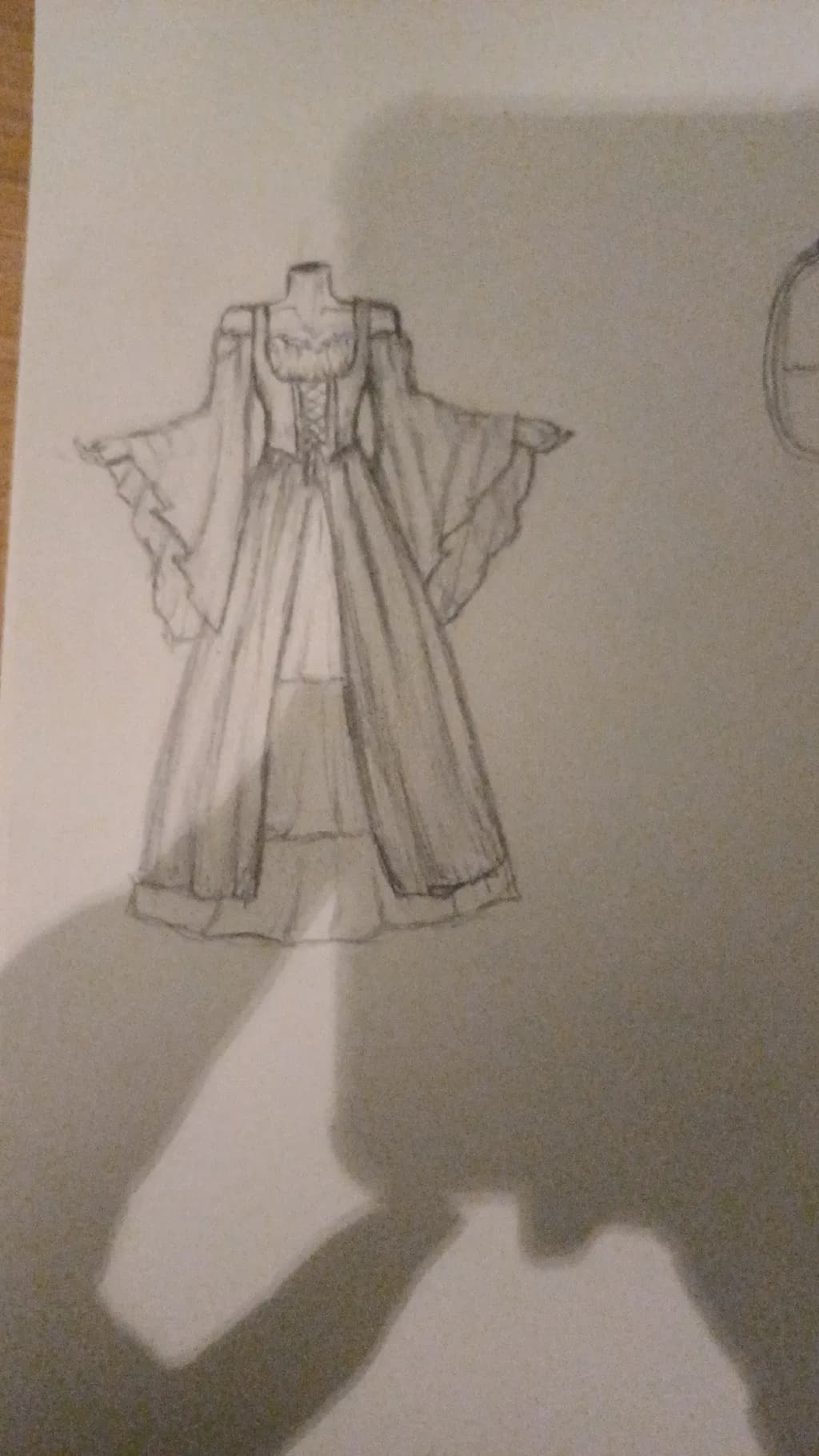 Whimsical Elegance: A Dreamy Gown Sketch with Flowing Sleeves and Intricate Details