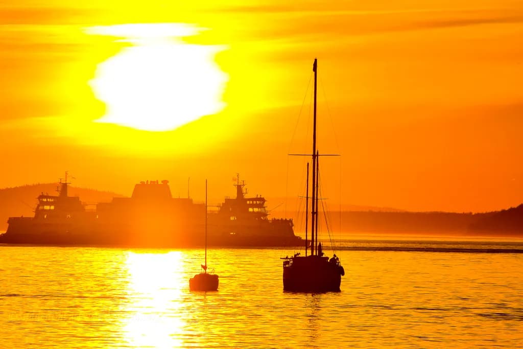 Serenity at Sunset: Boats Gliding Through Golden Waters