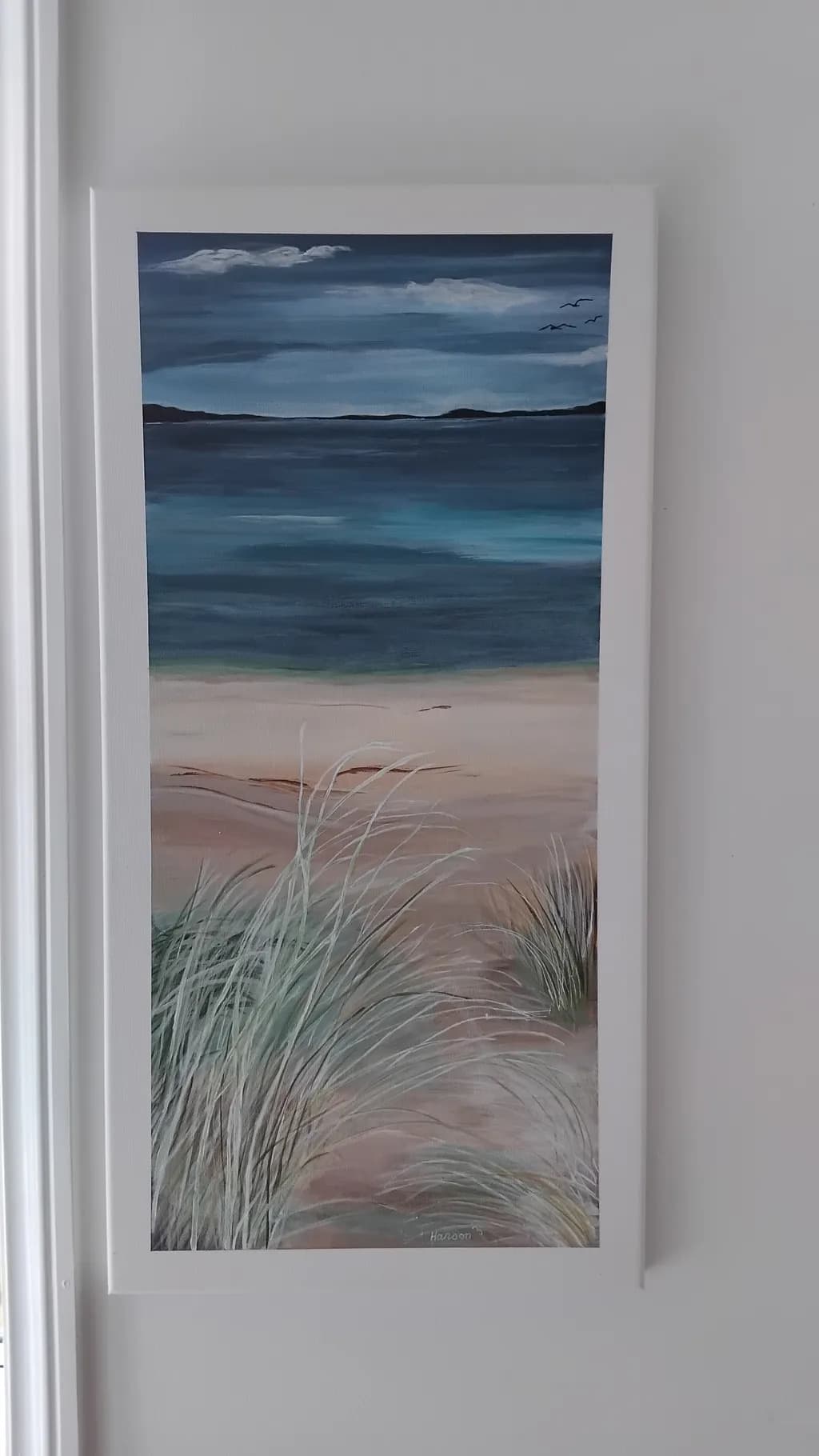 Serenity by the Shore: A Tranquil Coastal Landscape with Gentle Waves and Whispering Grasses
