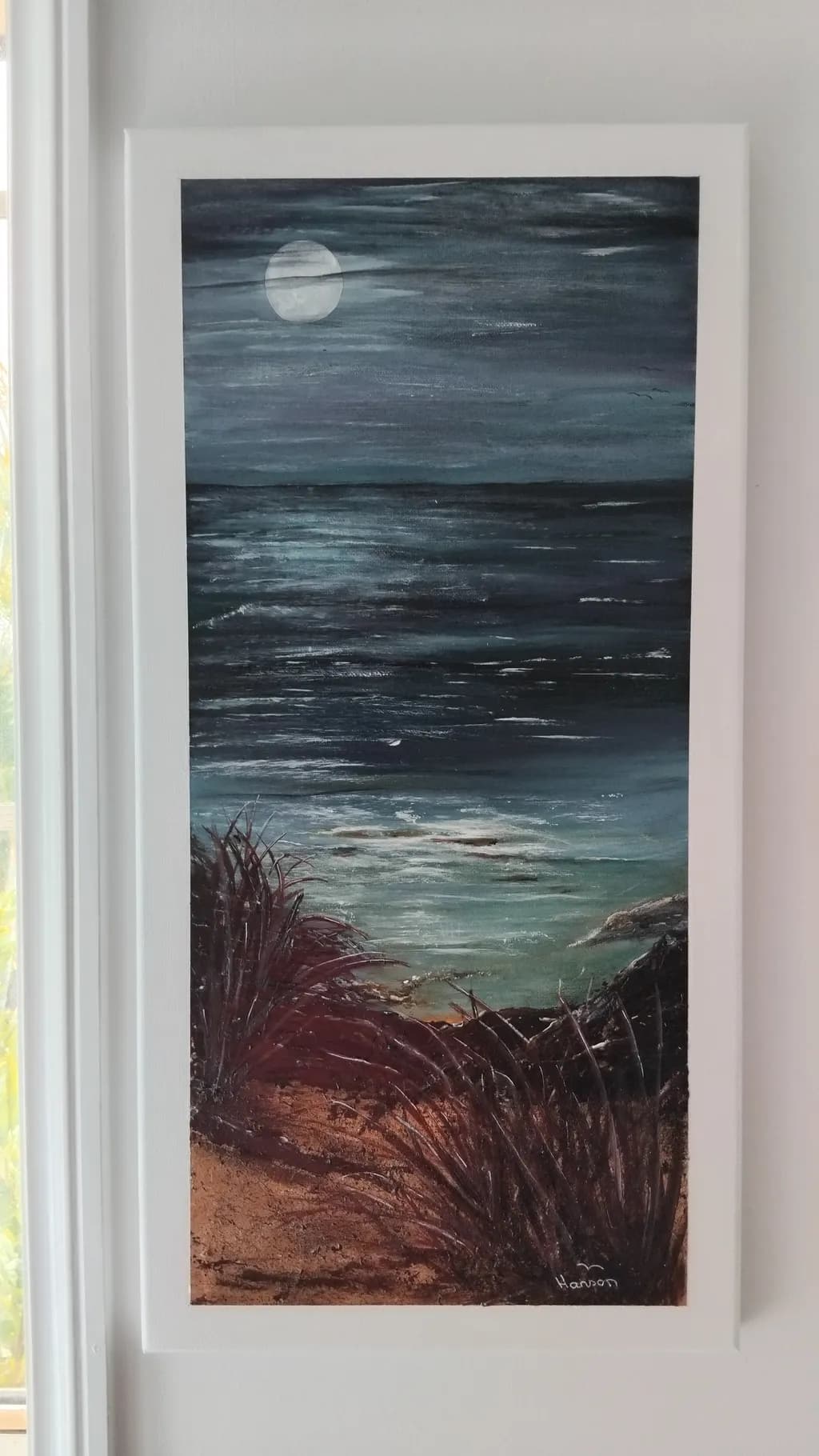 Moonlit Serenity: A Coastal Nightscape Embracing Nature's Tranquility