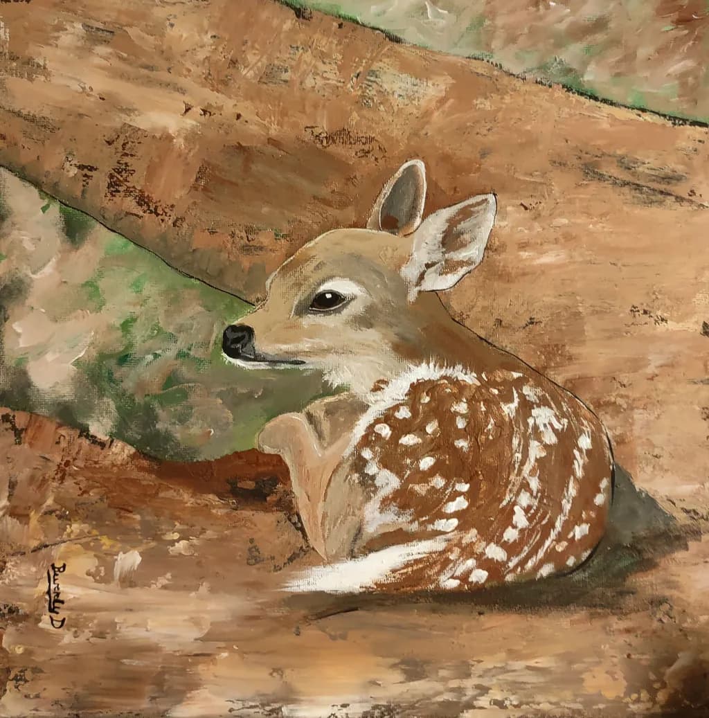 Whispers of the Forest: A Serene Fawn Resting Amidst Nature's Embrace