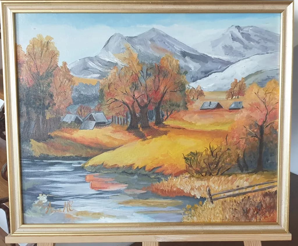 Autumn Serenity: A Tranquil Landscape of Golden Fields and Majestic Mountains