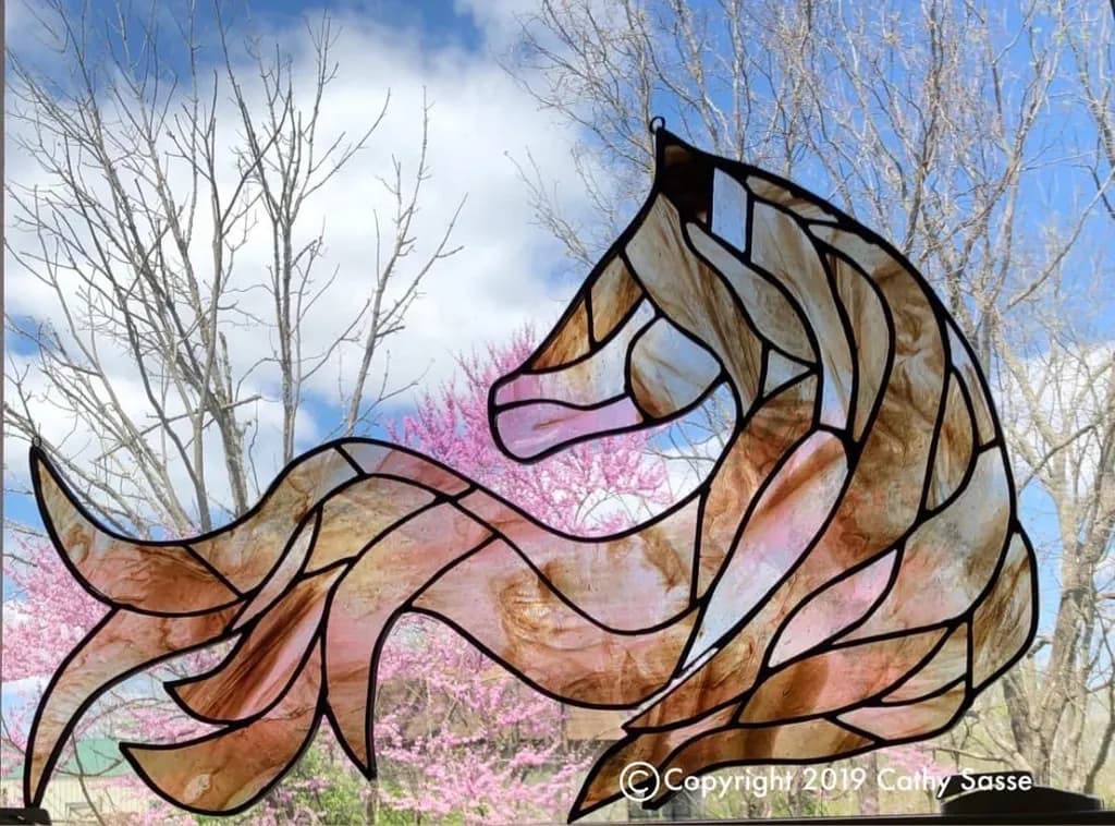 Whispers of Nature: A Colorful Stained-Glass Horse Silhouette Against a Blooming Sky
