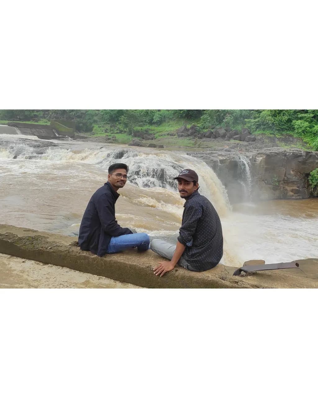 Whispers of Adventure: Friends by the Waterfall in Nature's Embrace