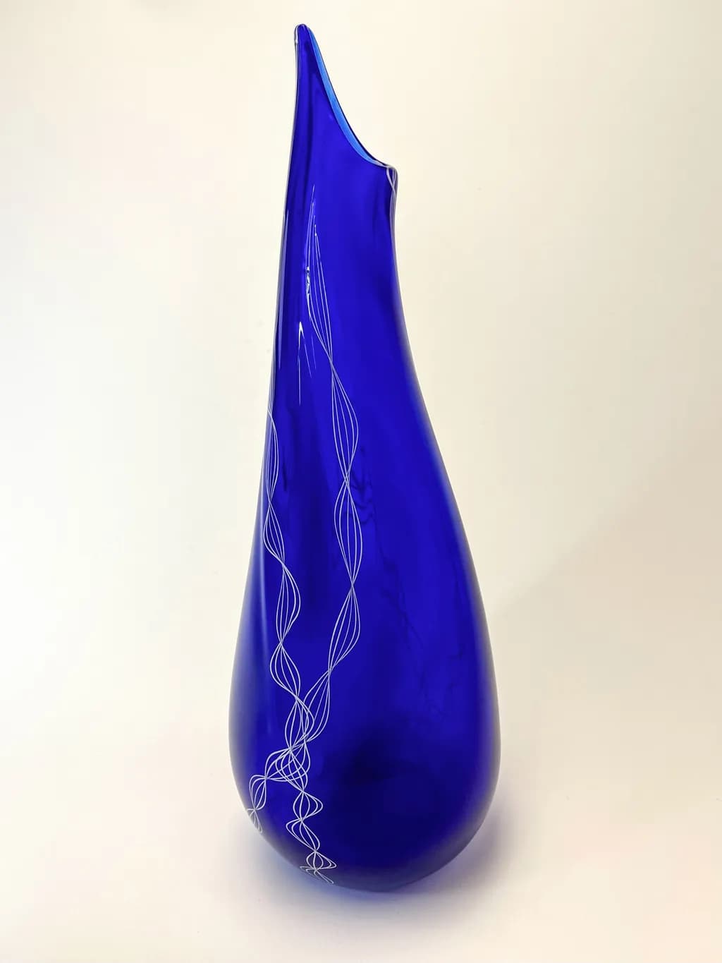Elegant Blue Glass Vase with Unique Artistic Design and Decorative Touches