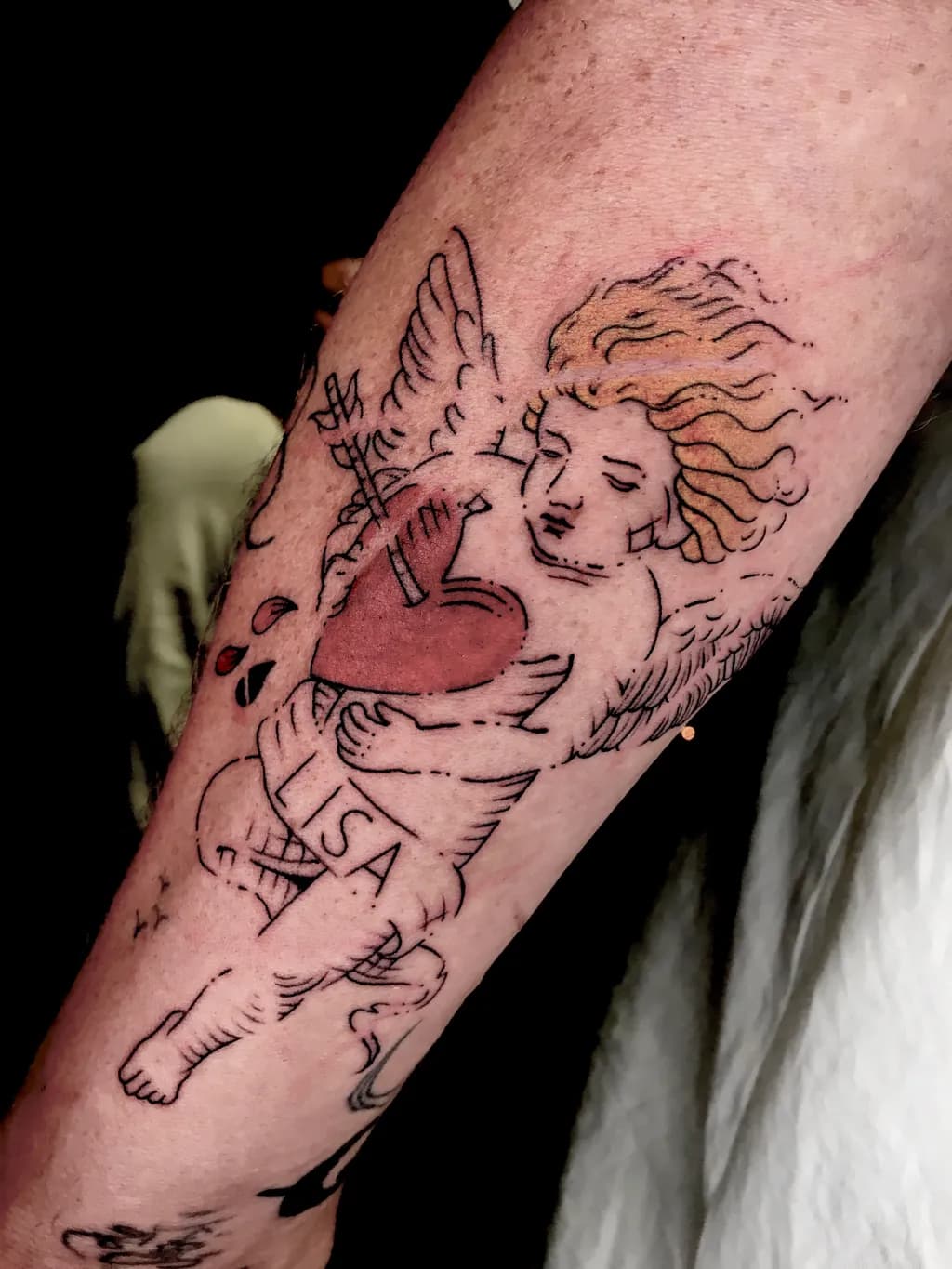 Ethereal Love: Cherubic Embrace Tattoo with Heart and Personal Touch