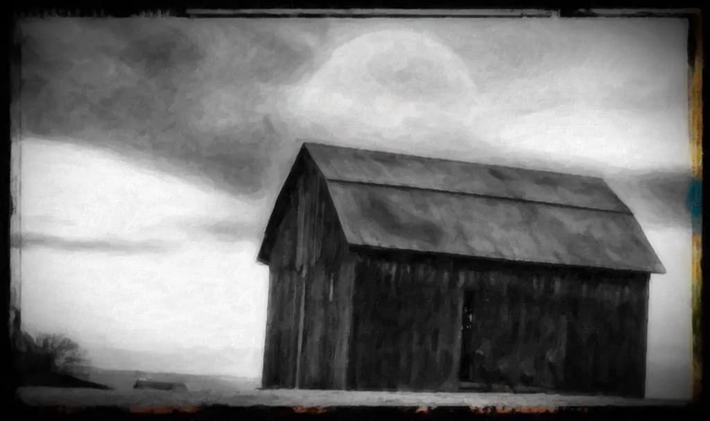 Whispers of Time: A Weathered Barn Beneath Cloudy Skies