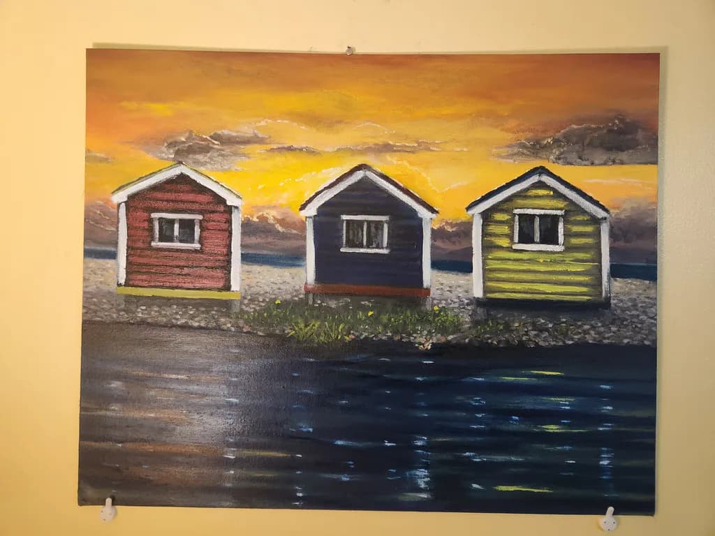Serene Sunset Over Colorful Coastal Cottages: A Tranquil Landscape Reflection