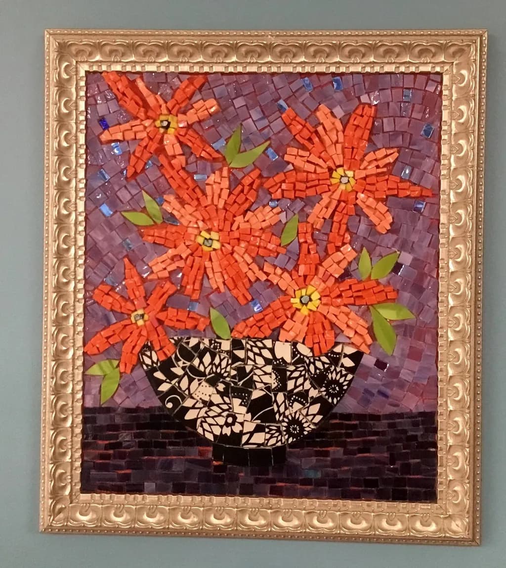 Vibrant Mosaic Blooms: A Colorful Floral Arrangement in a Decorative Vase