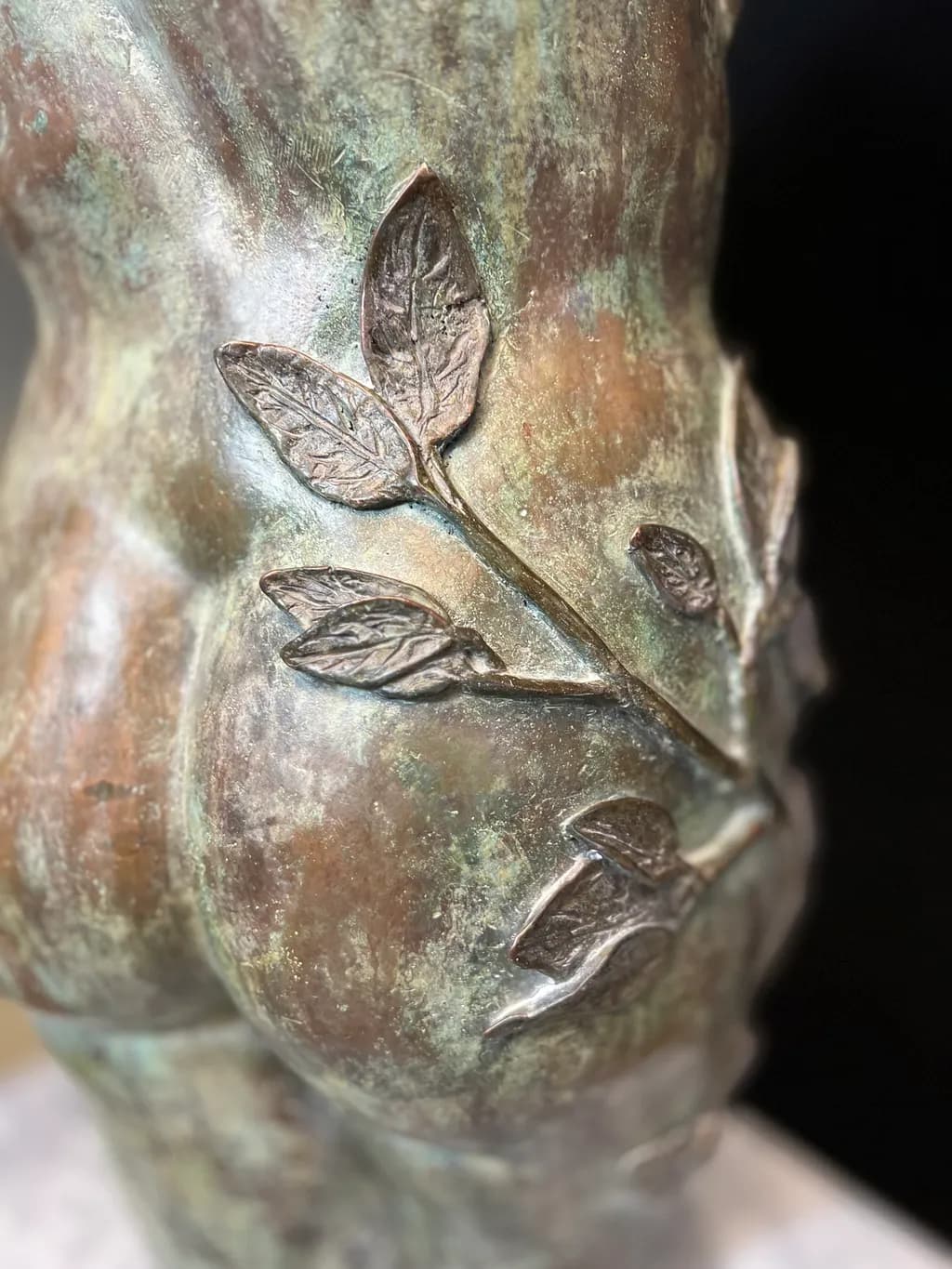 Whispers of Nature: A Bronze Embrace of Form and Flora