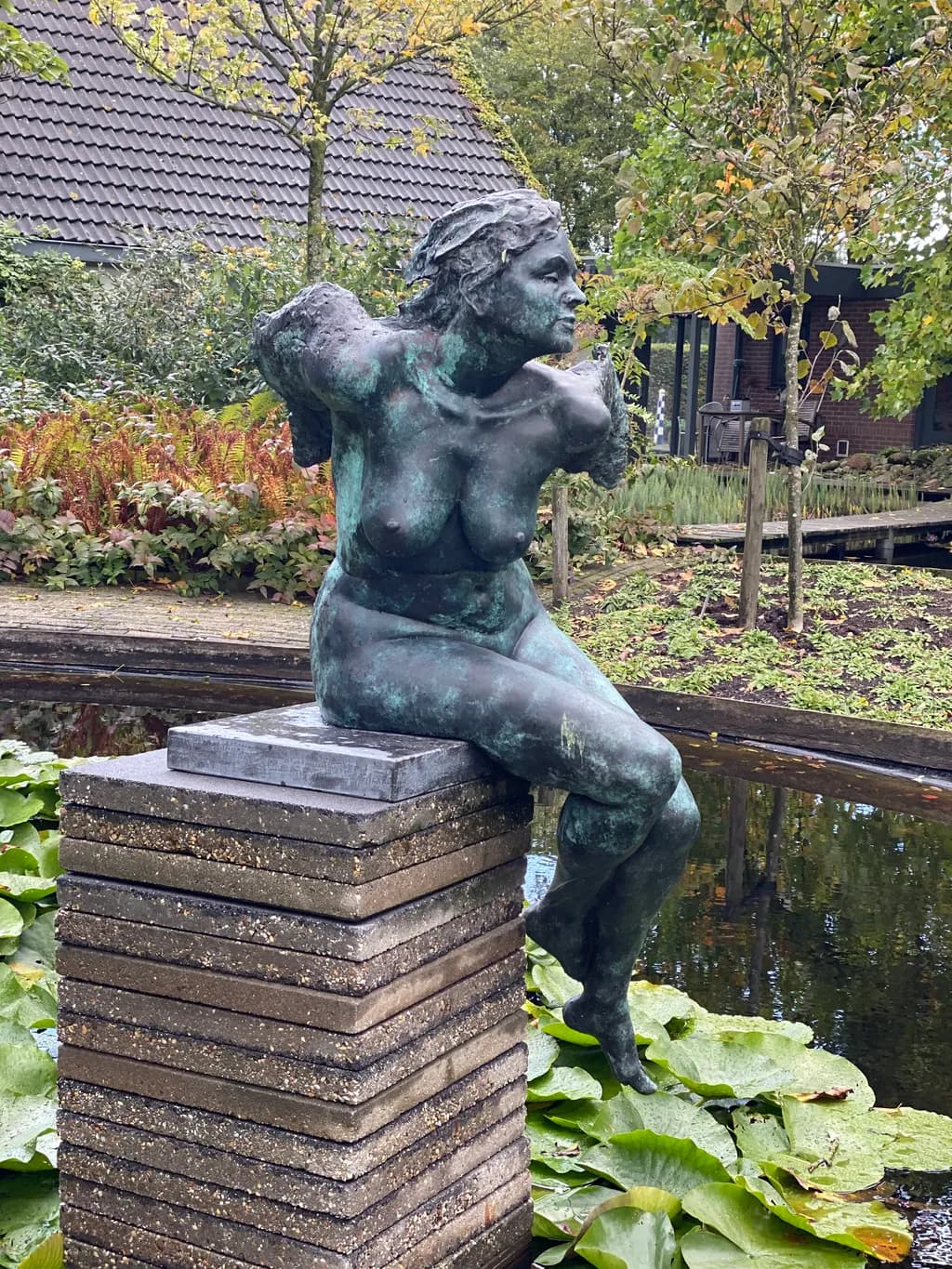 Serenity in Bronze: A Captivating Figure Embracing Nature's Beauty