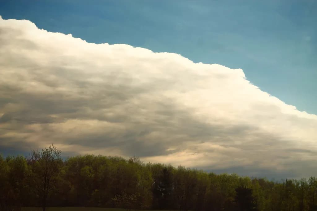 Serenity Above: A Dramatic Sky Embracing Nature's Canvas