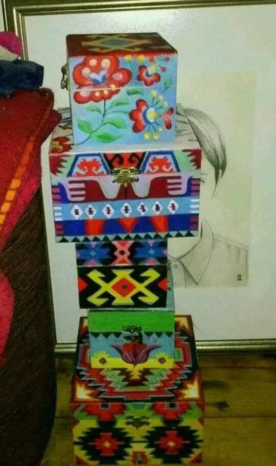 Colorful Stacked Boxes: A Vibrant Decorative Art Piece Celebrating Pattern and Design
