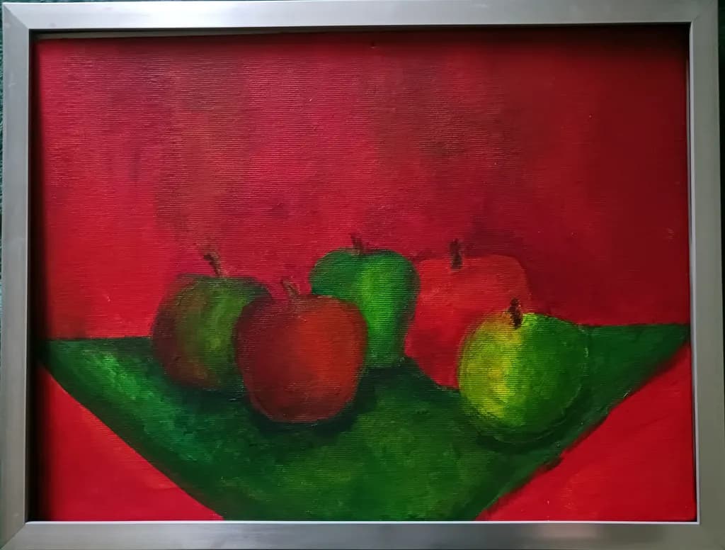 Vibrant Harmony: A Still Life of Apples on a Bold Red Canvas