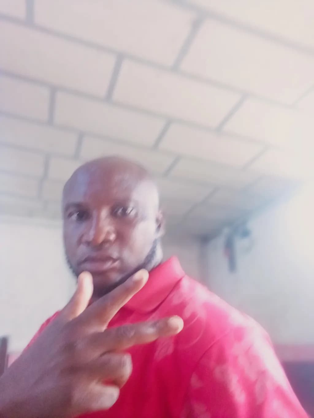 Vibrant Gesture: A Casual Portrait in Red Expression