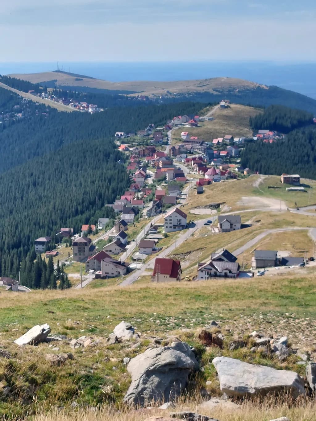 Mountain Serenity: A Panoramic View of Tranquil Village Life Amidst Nature's Embrace