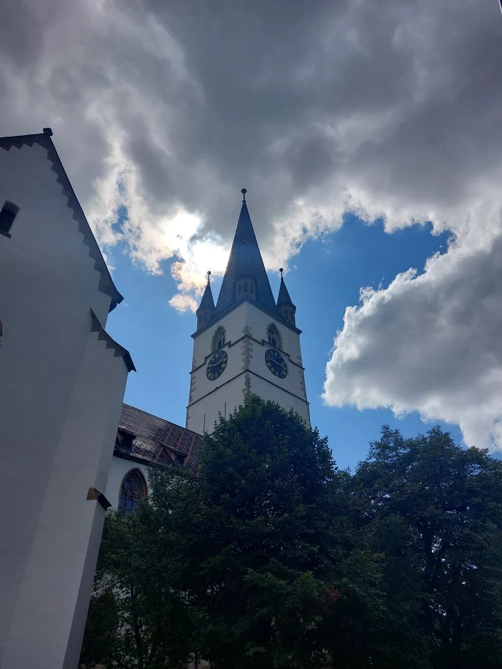 Whispers of Time: A Towering Church Beneath Dramatic Skies