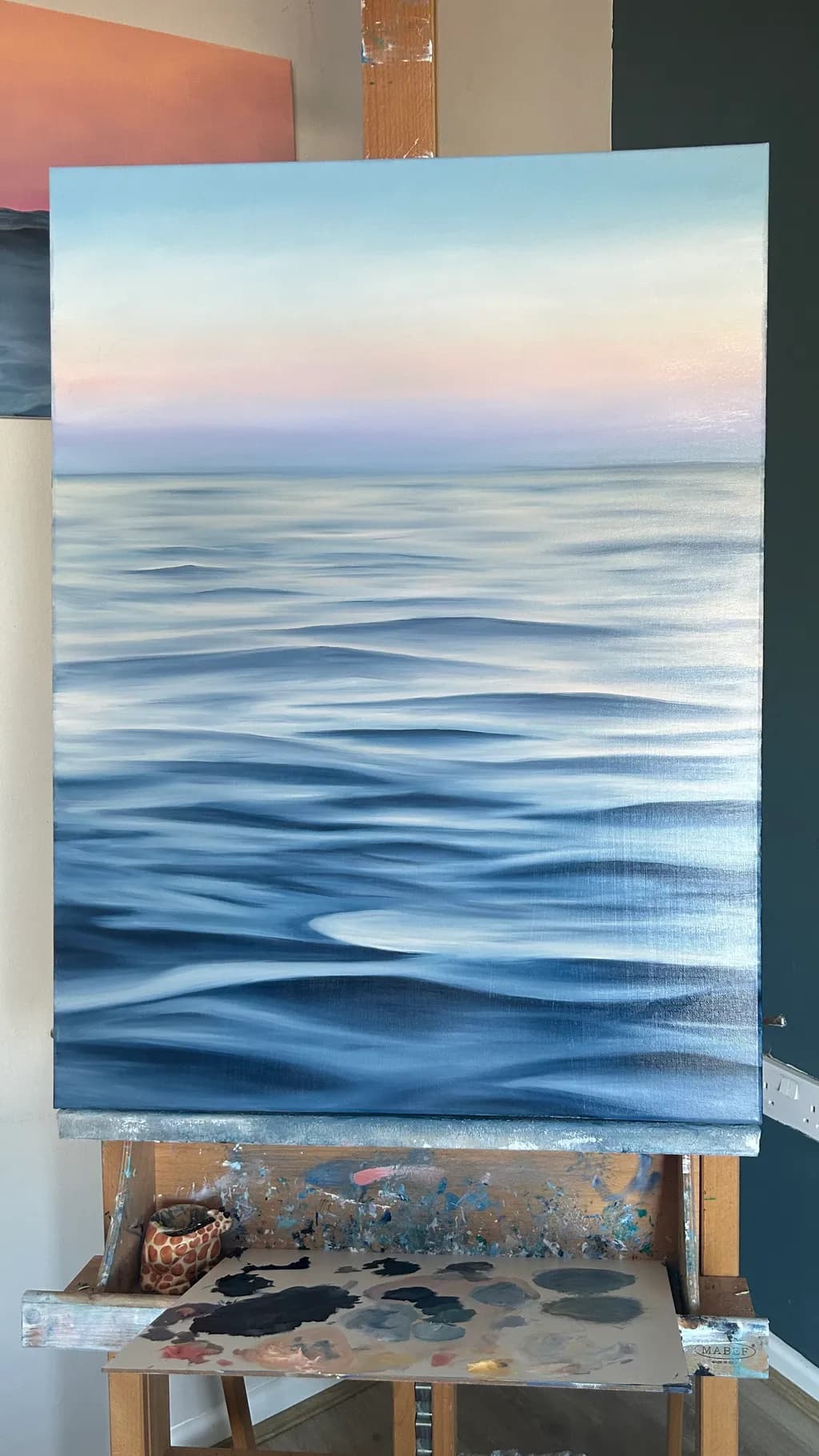 Serenity in Blue: A Tranquil Ocean Reflection at Dusk