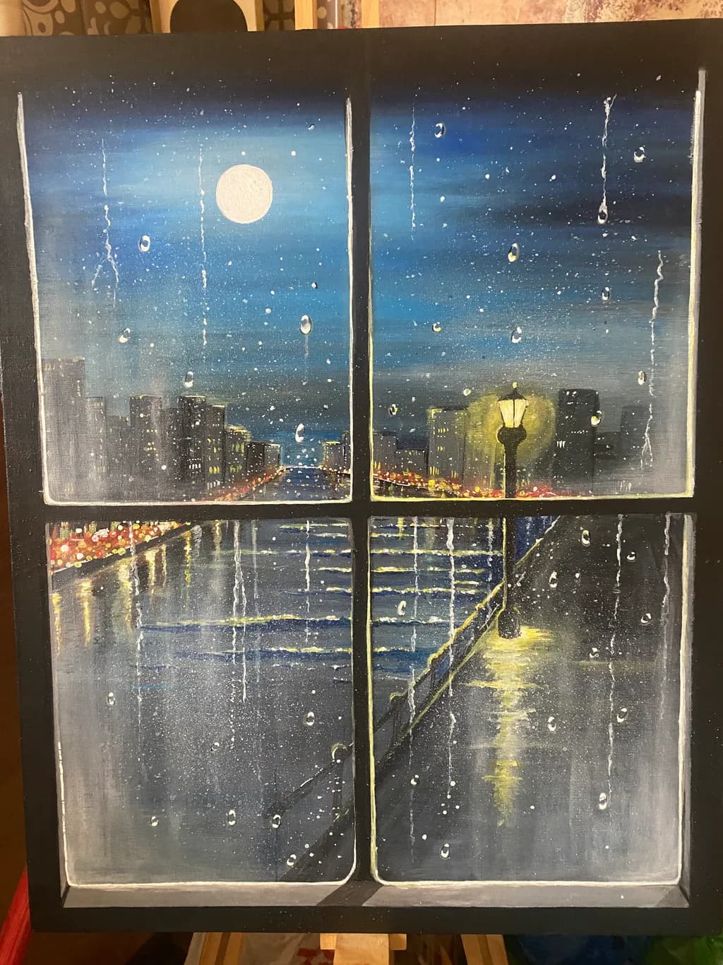 Rainy Cityscape Through Window