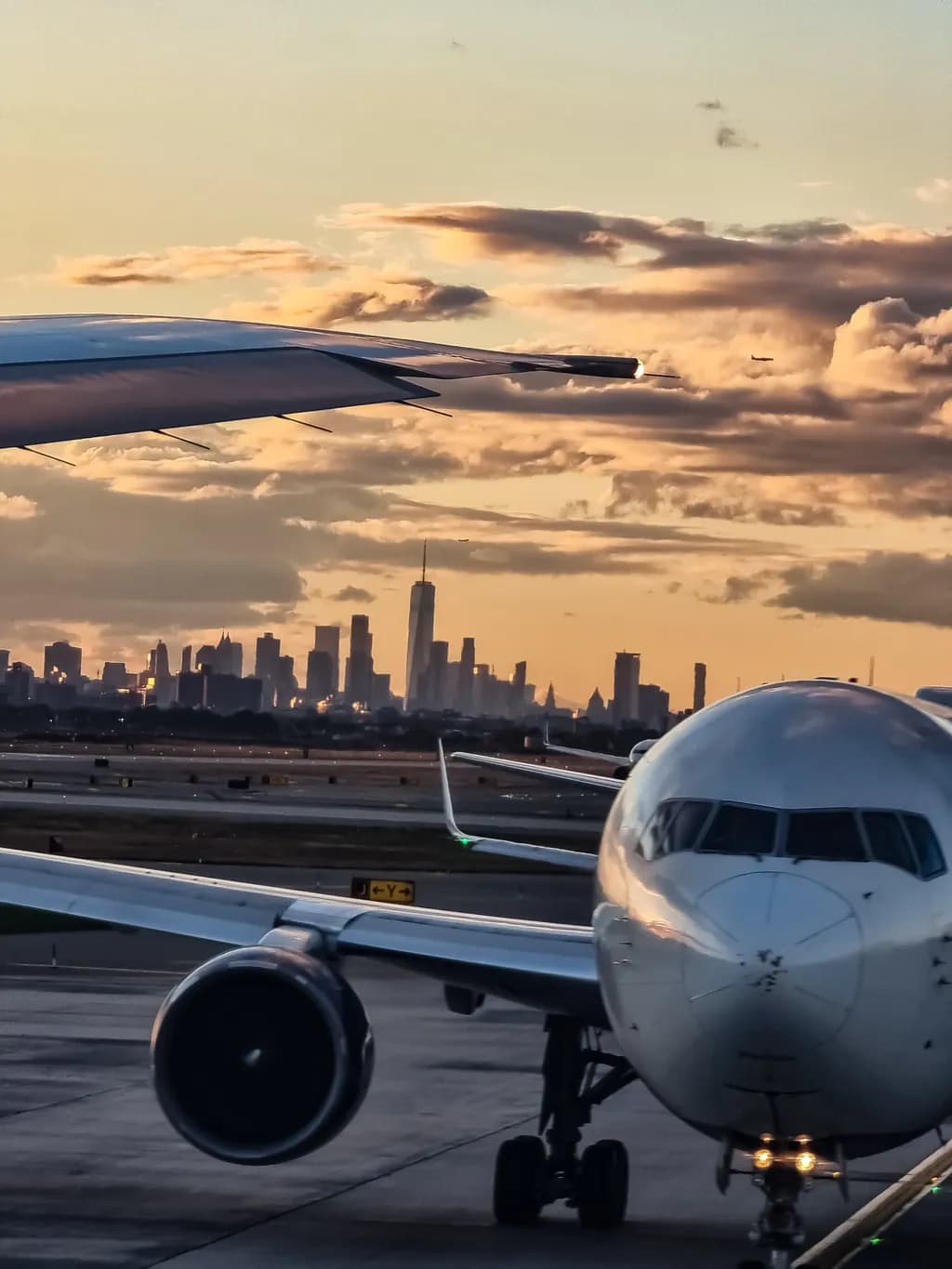 Urban Skies: A Journey Through Sunset and Flight