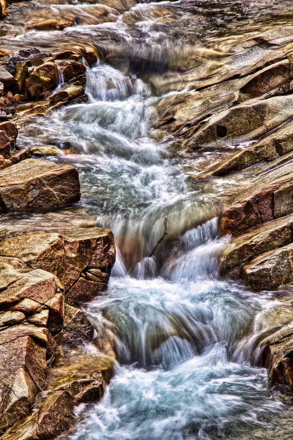 Whispers of the Stream: Nature's Flow Over Timeless Rocks
