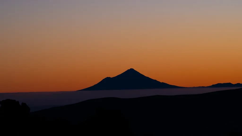 Majestic Silhouette: The Enigmatic Peak at Dusk