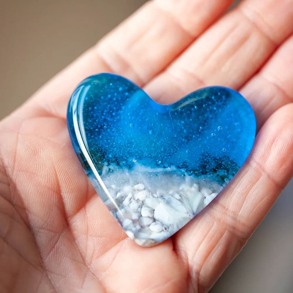 Ocean Heart: A Captivating Resin Art Piece with Blue Tones and Natural Elements