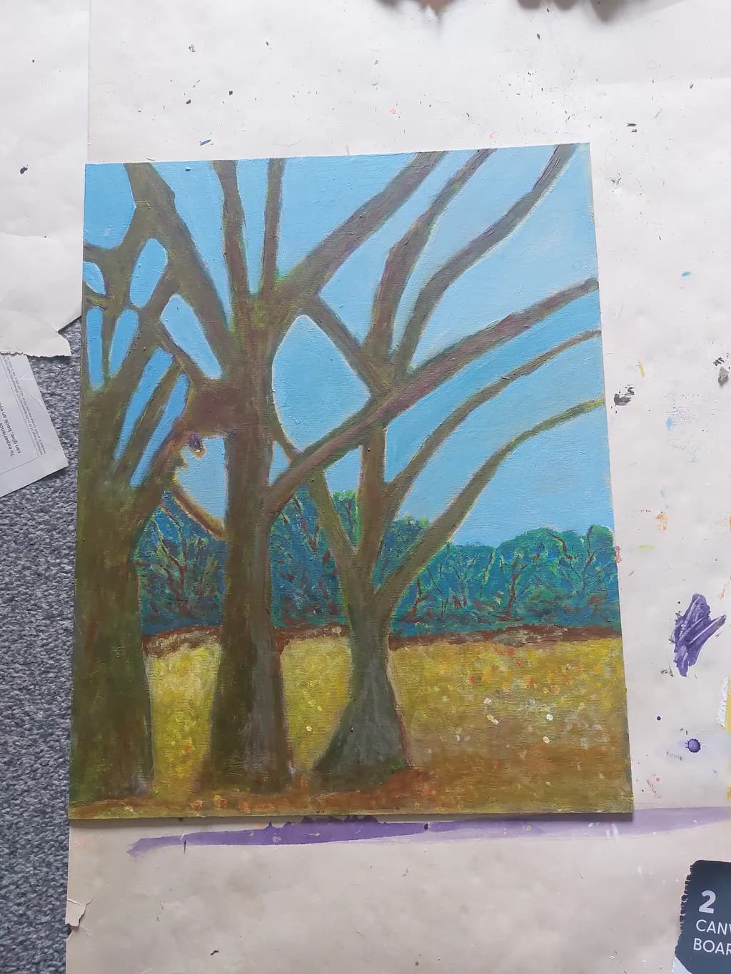Whispers of Nature: A Tranquil Landscape of Trees Under a Blue Sky