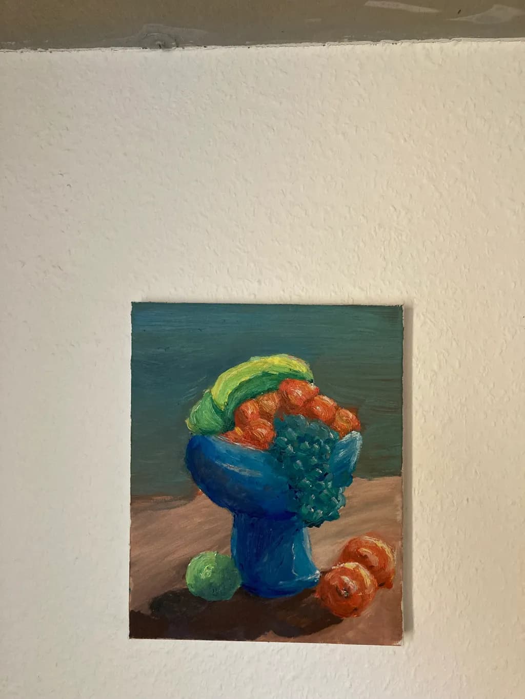 Vibrant Harmony: A Colorful Still-Life of Fruit in a Blue Bowl