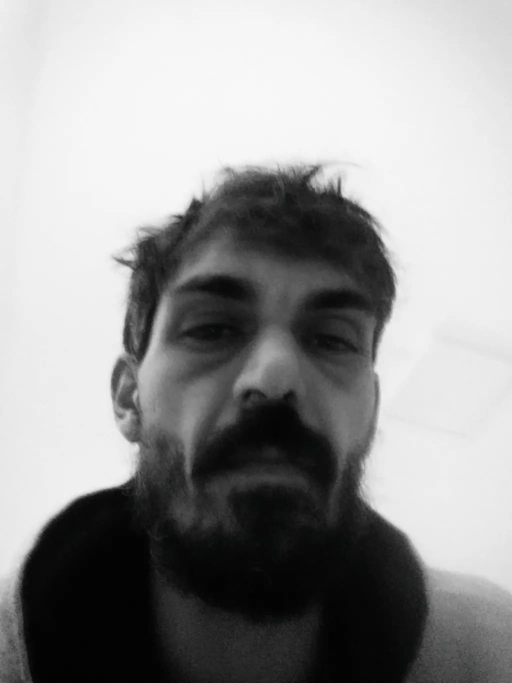 Moody Reflections: A Black-and-White Portrait of Expression and Identity