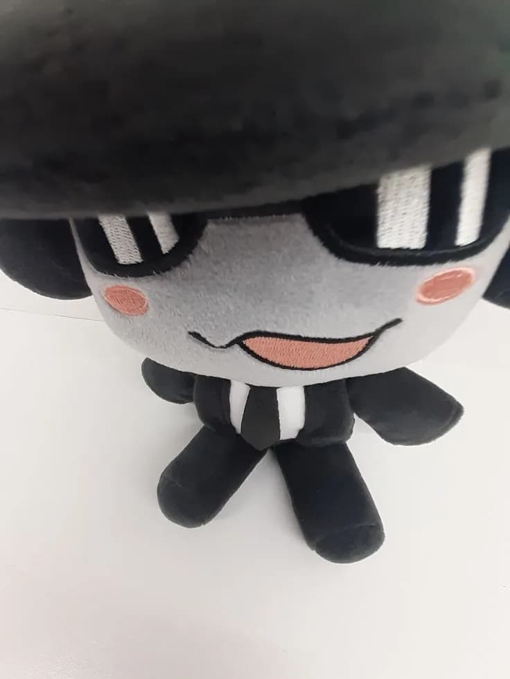 Charming Plush Character in a Stylish Hat: A Cute Companion with a Smile
