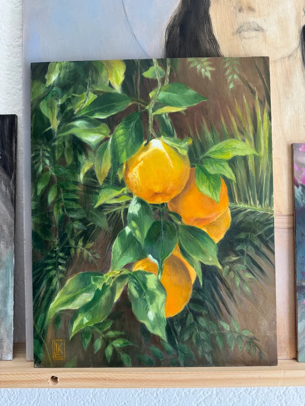 Citrus Serenade: A Lush Portrait of Golden Oranges Amidst Verdant Leaves