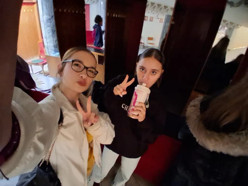 "Moments of Joy: A Playful Selfie in a Cozy Space"