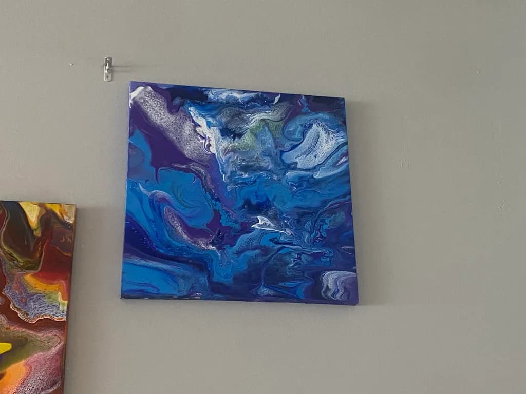 Whispers of the Ocean: An Abstract Dance of Blue Swirls on Canvas