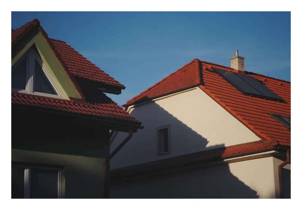 Whispers of Light: A Dance of Shadows on Rooftops