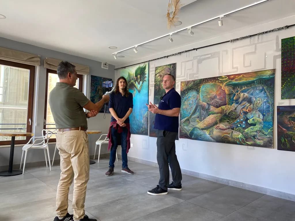 Creative Conversations: An Artistic Interview Amidst Vibrant Paintings