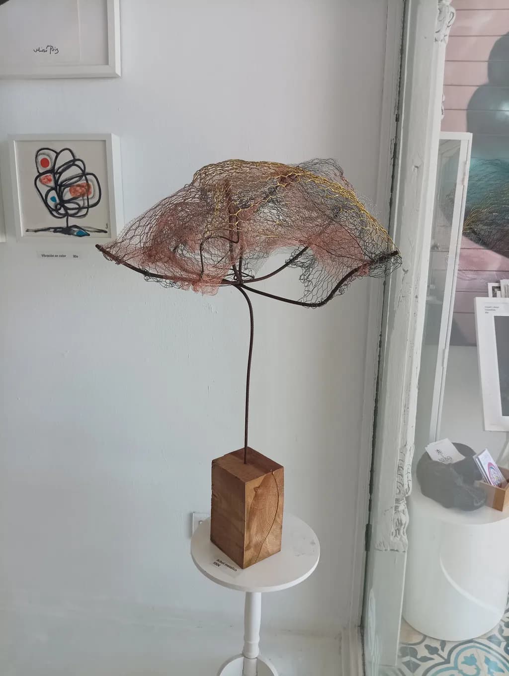 Whispers of Nature: A Delicate Fusion of Metal and Fabric in Sculptural Form