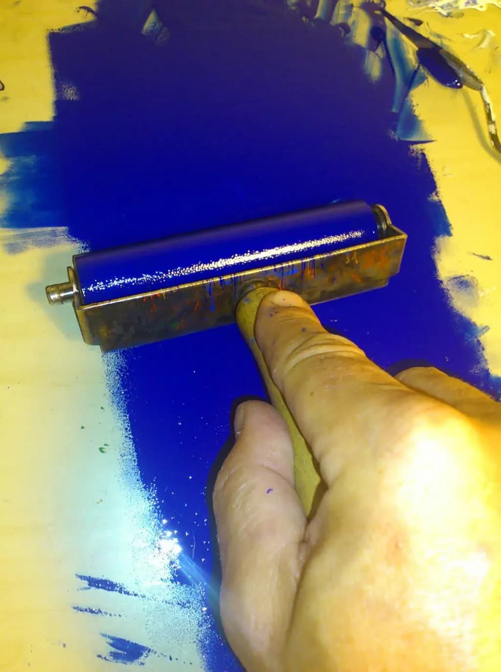 Vibrant Blue Impressions: The Art of Roller Printing in Motion