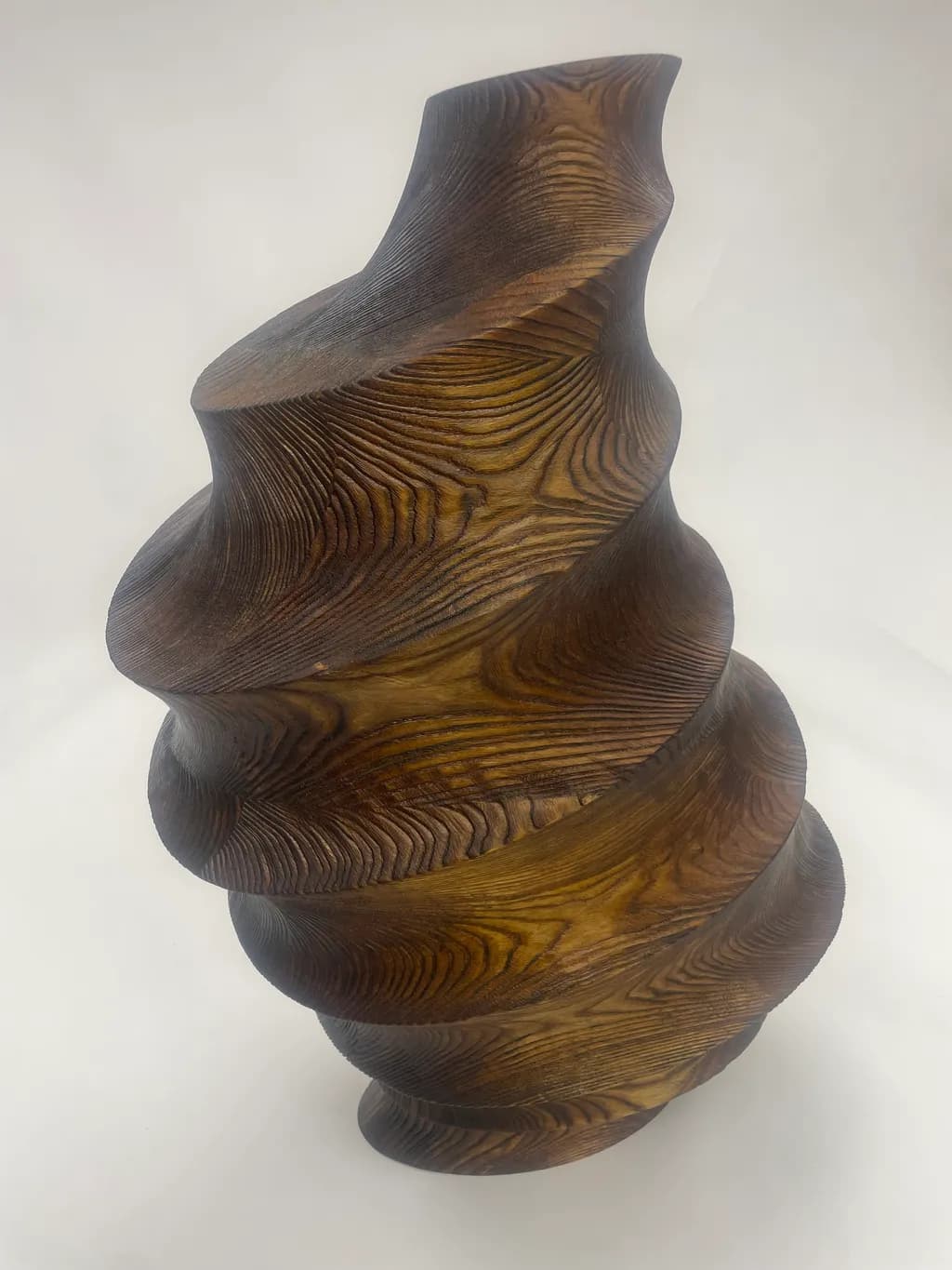 Whispers of Nature: A Spiraling Wooden Sculpture Embracing Organic Elegance