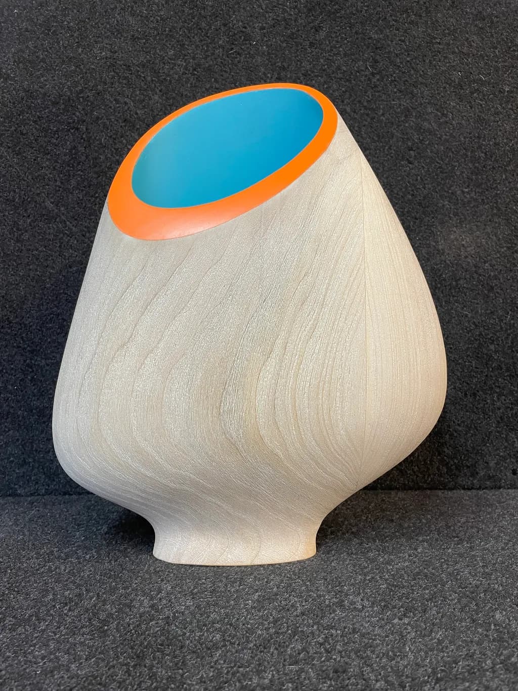 Whimsical Harmony: A Contemporary Wooden Vessel with Vibrant Accents