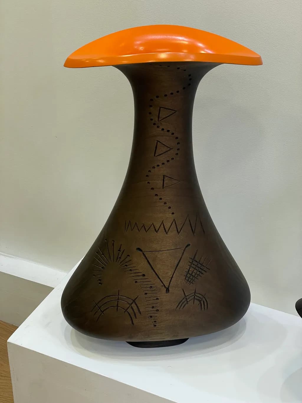Vibrant Harmony: A Contemporary Sculptural Vessel with Intricate Patterns and Bold Orange Accent