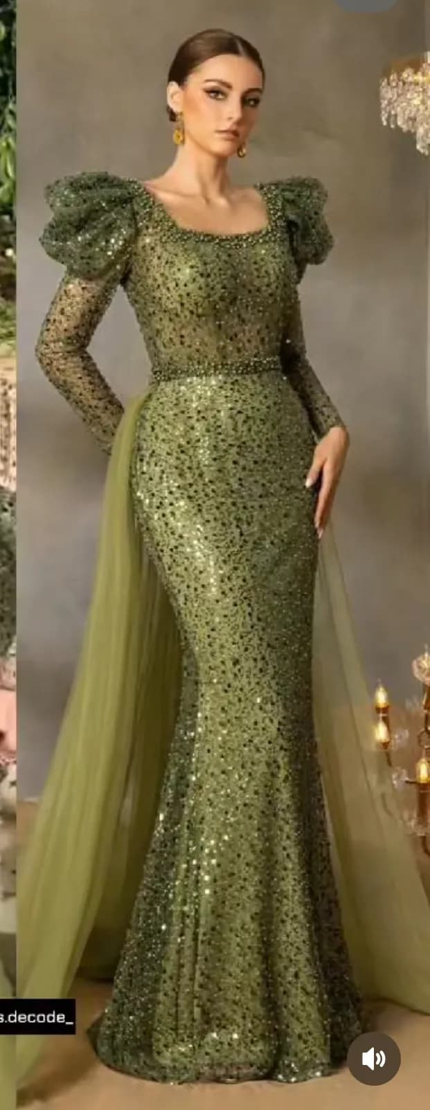 Emerald Elegance: A Sparkling Evening Gown with Dramatic Puff Sleeves and Flowing Train