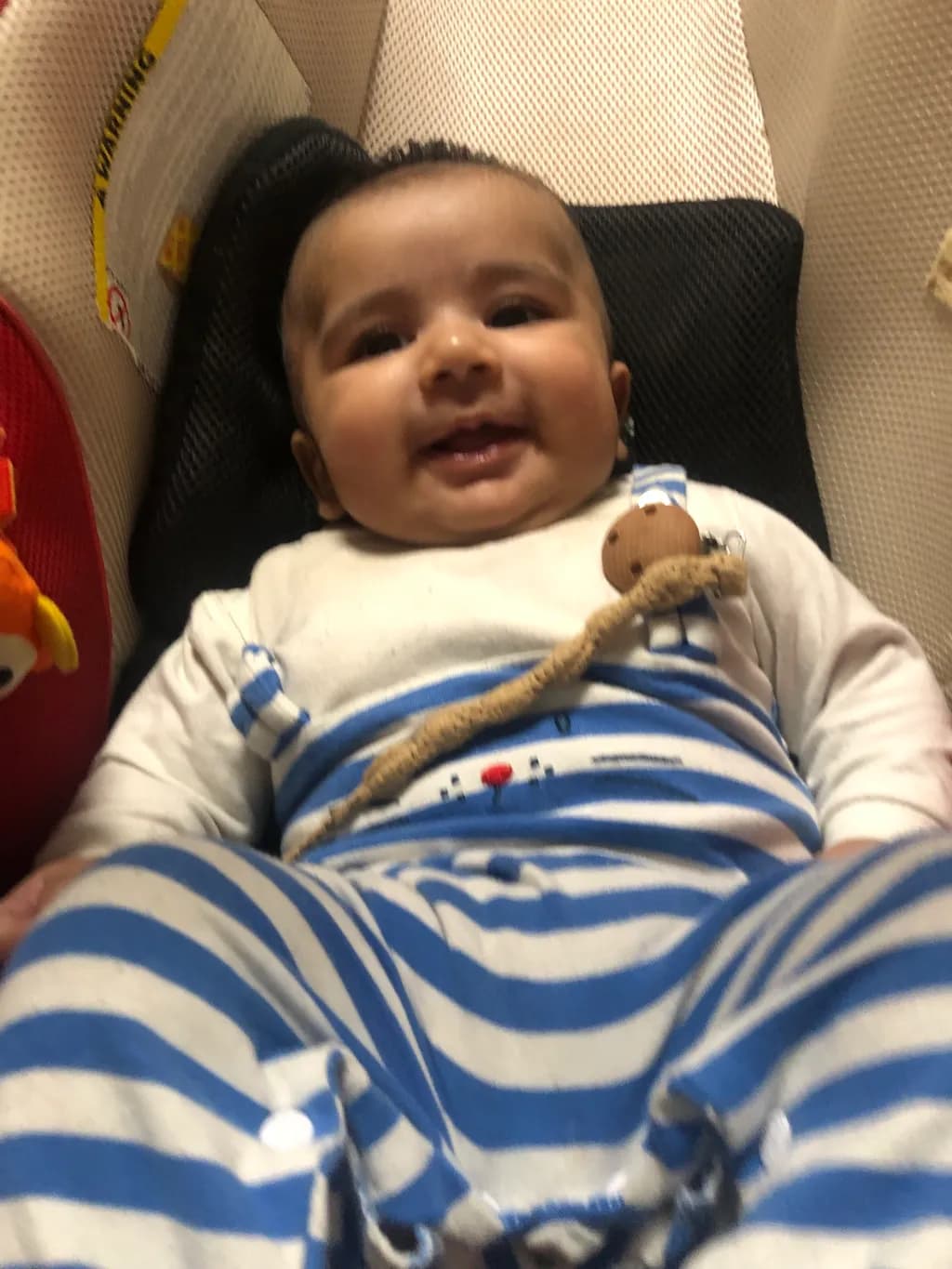 Joyful Moments: A Cherubic Smile in Stripes
