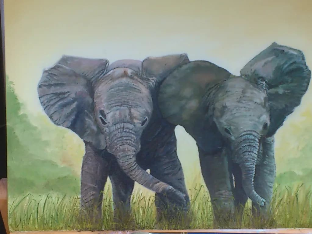 Majestic Companions: A Tender Moment Between Two Elephants in Nature