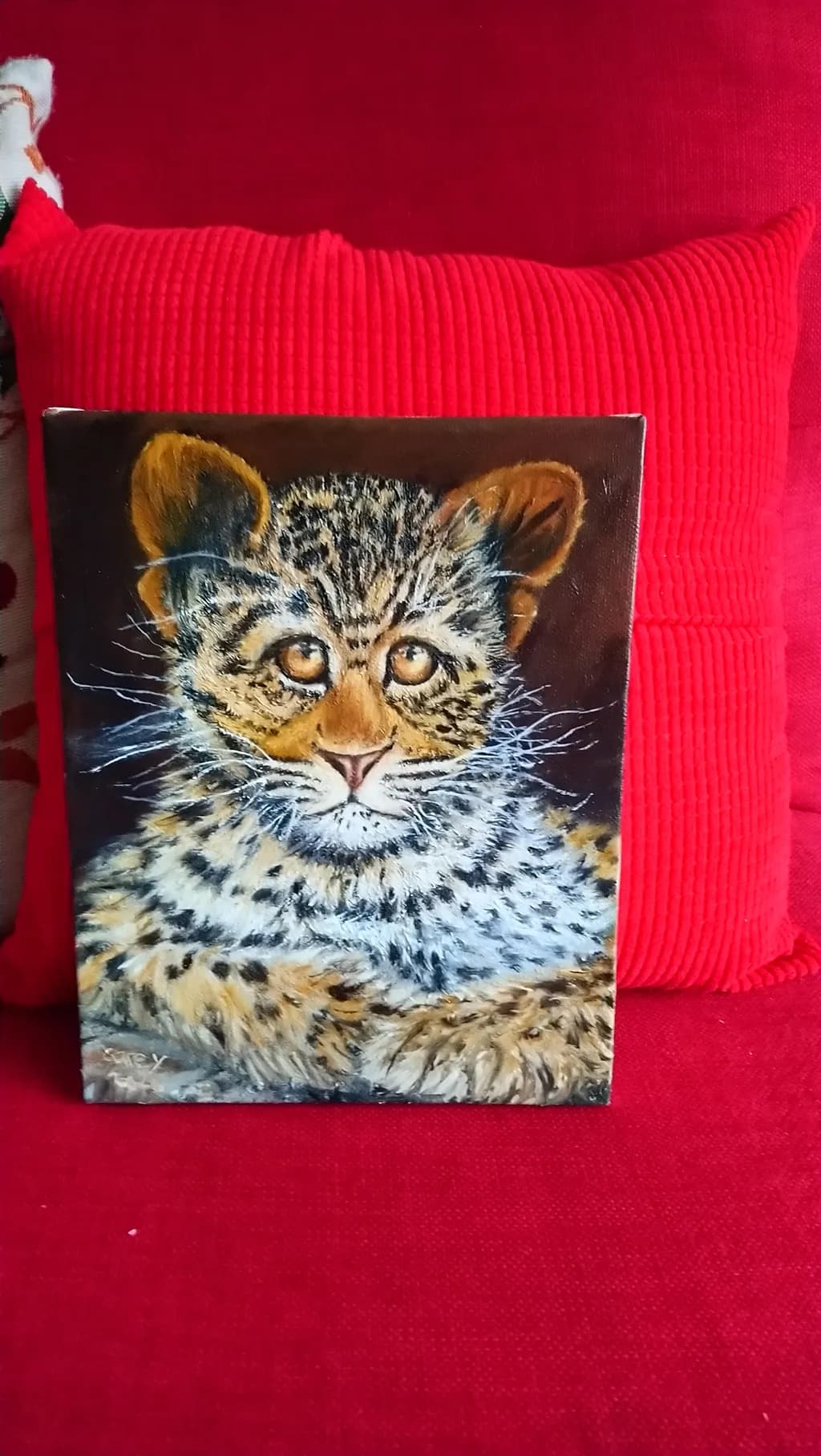 Whiskered Wonder: A Realistic Portrait of a Playful Leopard Cub