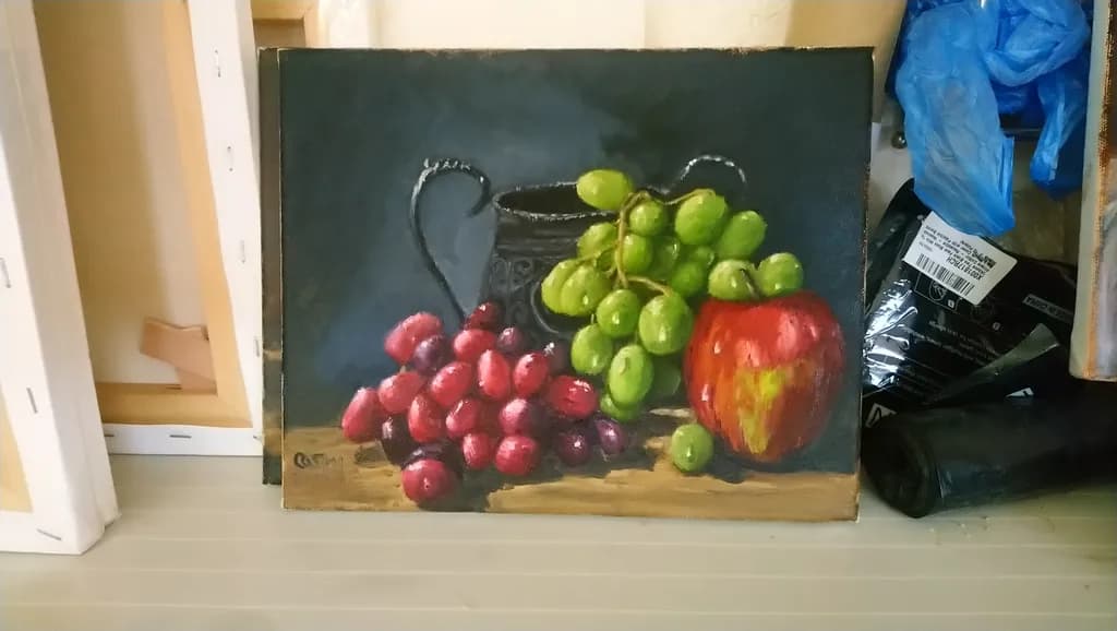 Vibrant Harvest: A Still Life of Grapes and Apples in Rich Hues