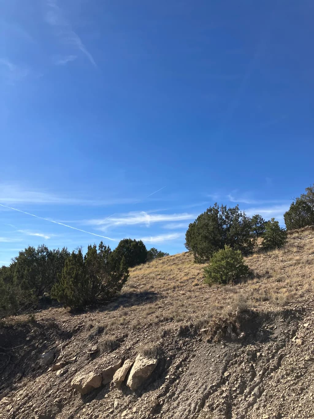 Blue Sky Over Rocky Hillside