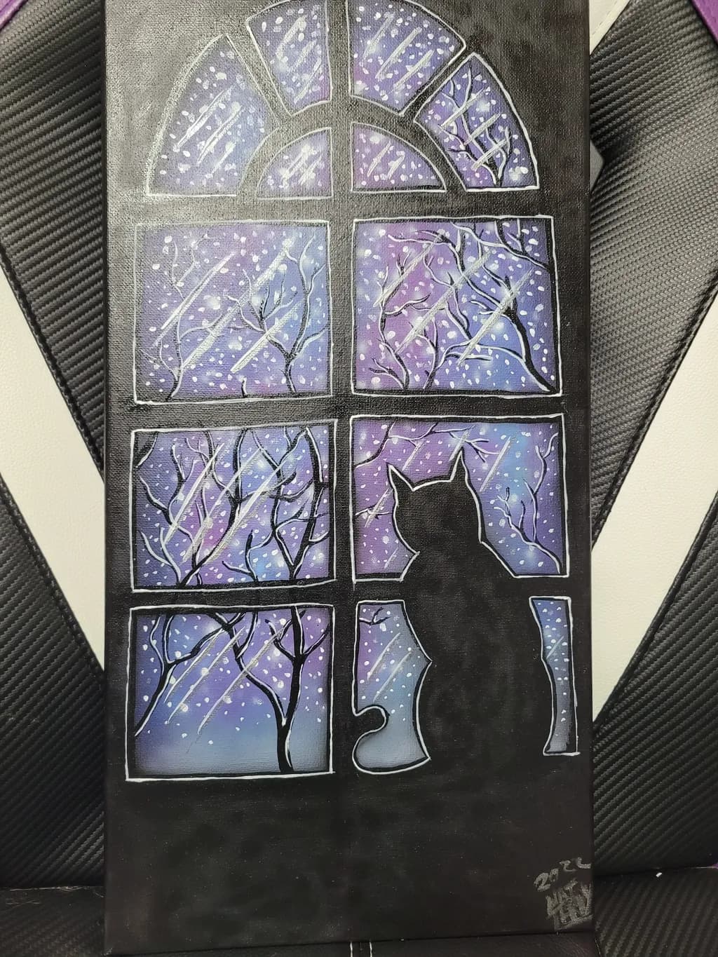 Whispers of Winter: A Cat's Gaze Through the Snowy Window at Night