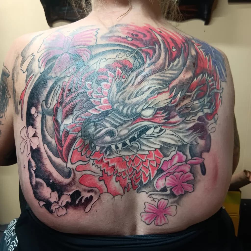 Majestic Dragon Embrace: A Vibrant Tattoo Journey Through Nature's Beauty