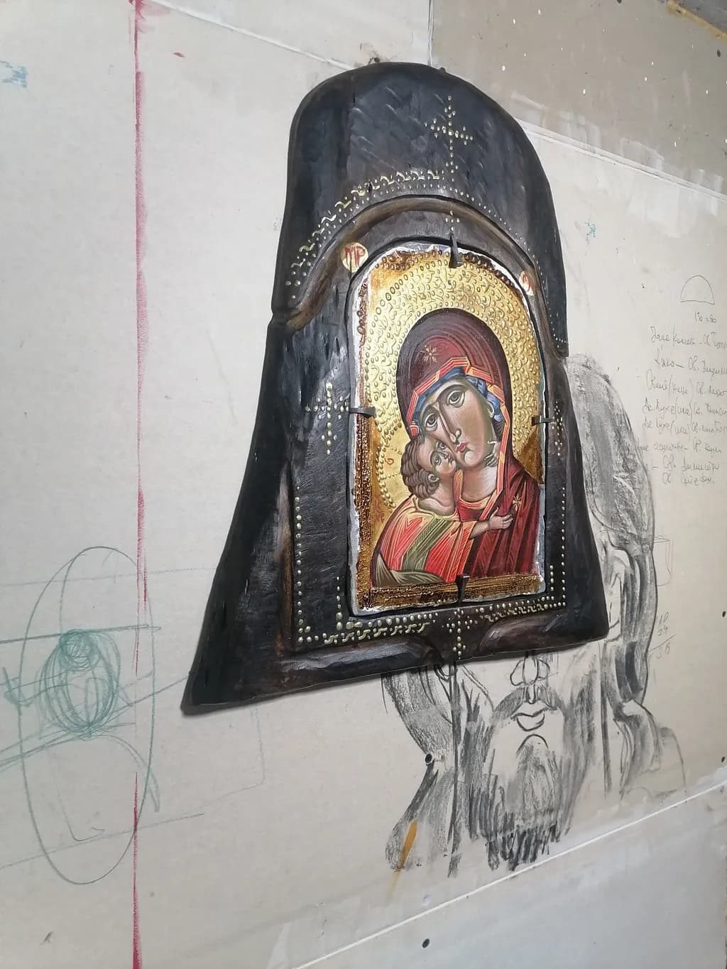 Divine Embrace: A Sacred Portrait of Mother and Child in Wood and Gold